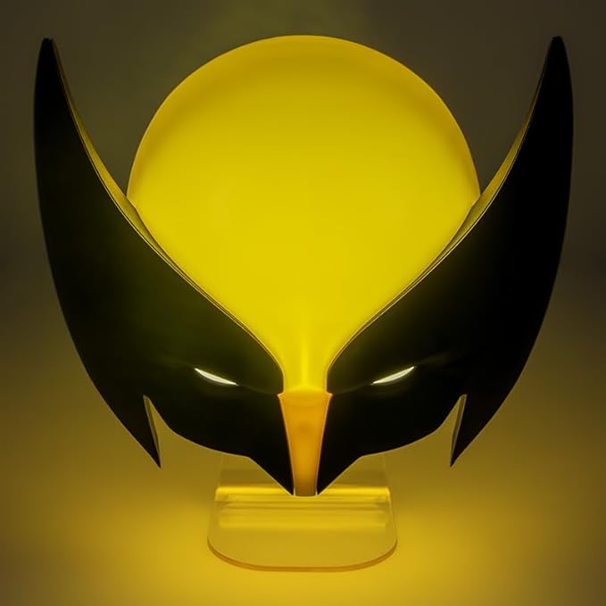 Yellow and black mask on a stand with a dark background