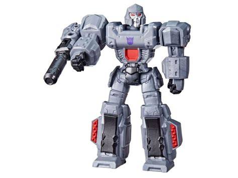 A gray Transformers action figure with a red chest emblem, holding a black cannon, shown against a plain white background.